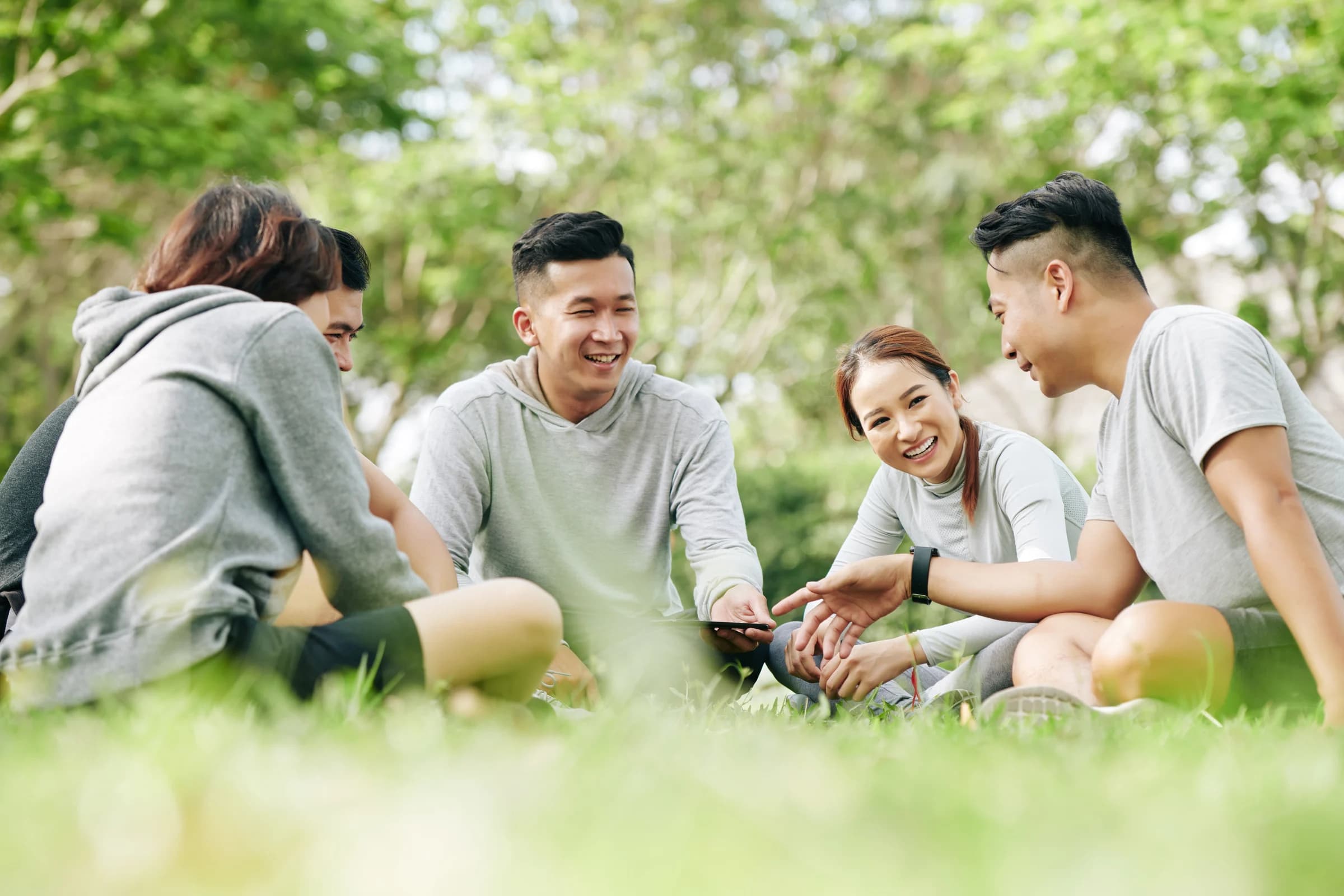 Group of students socializing outdoors on campus